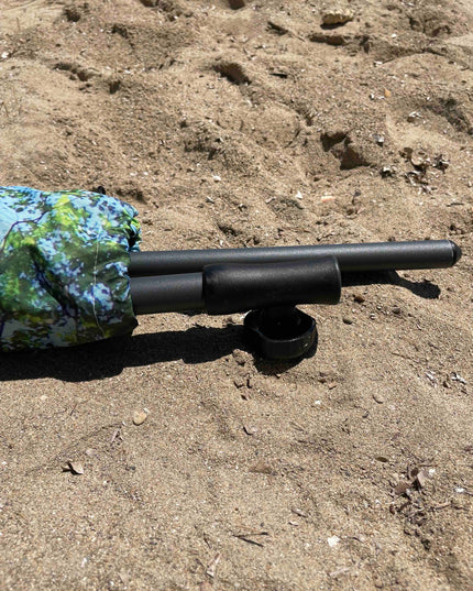 Skogsstrand och terrassparasoll